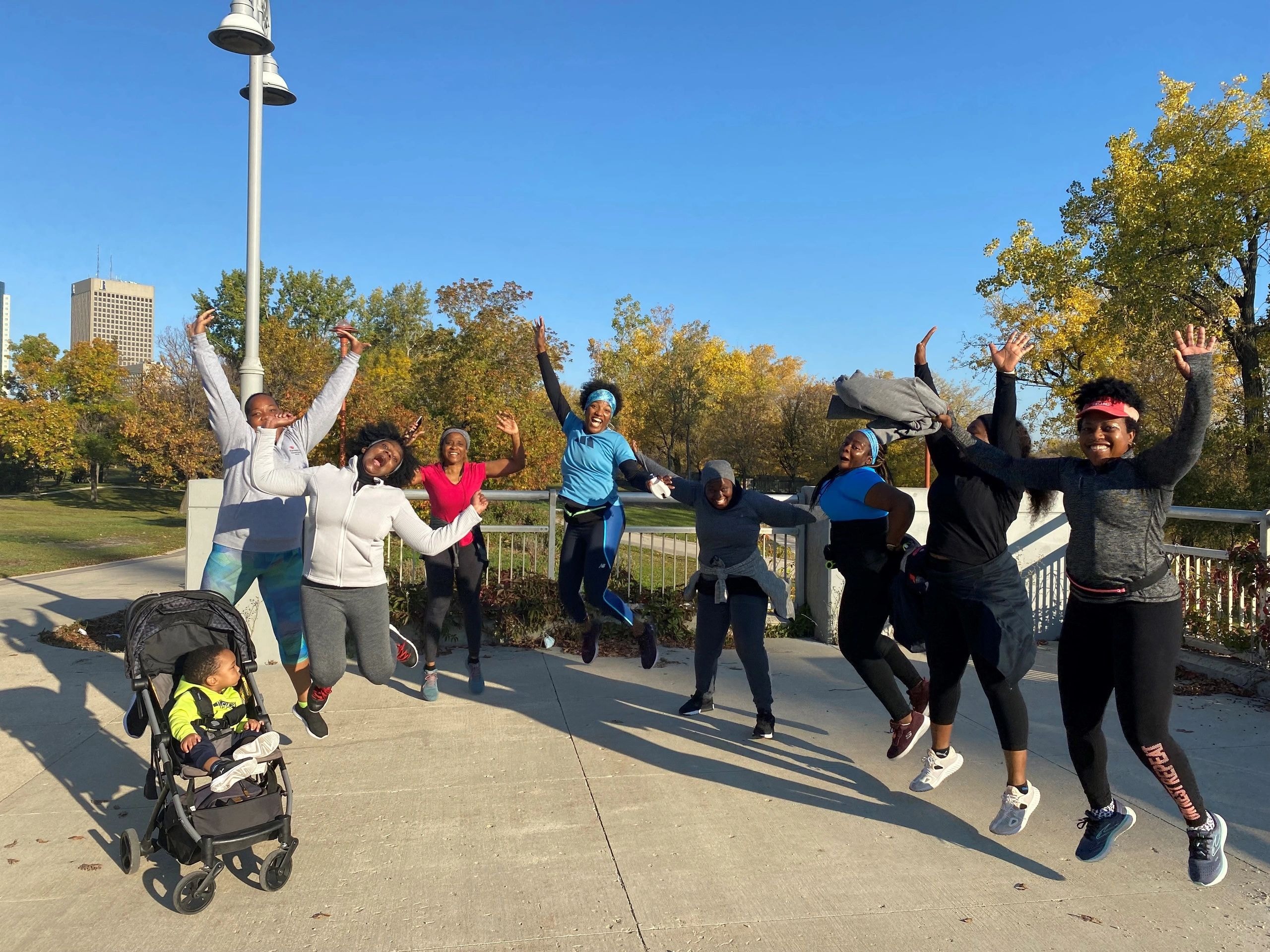 Pegcity Steppers members celebrating together at a waterfront event